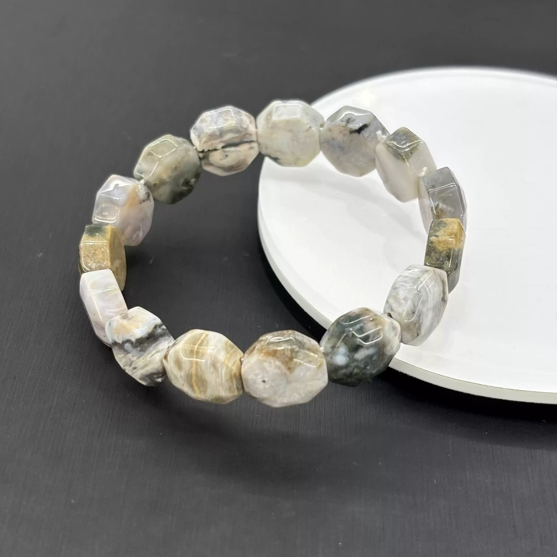 Semi-translucent Ocean Jasper beads revealing depth of natural mineral layers—genuine Madagascar origin, GIA-recognized variety