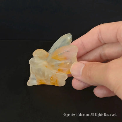 Translucent yellow hematoid quartz crystal flower fairy statue with natural golden inclusions