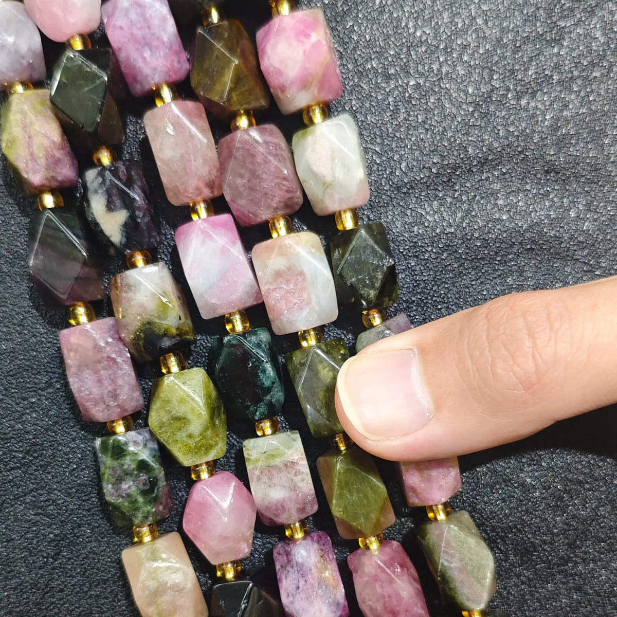 Strands of multi color tourmaline faceted freeform beads displaying rose pink watermelon green and olive crystal nuggets