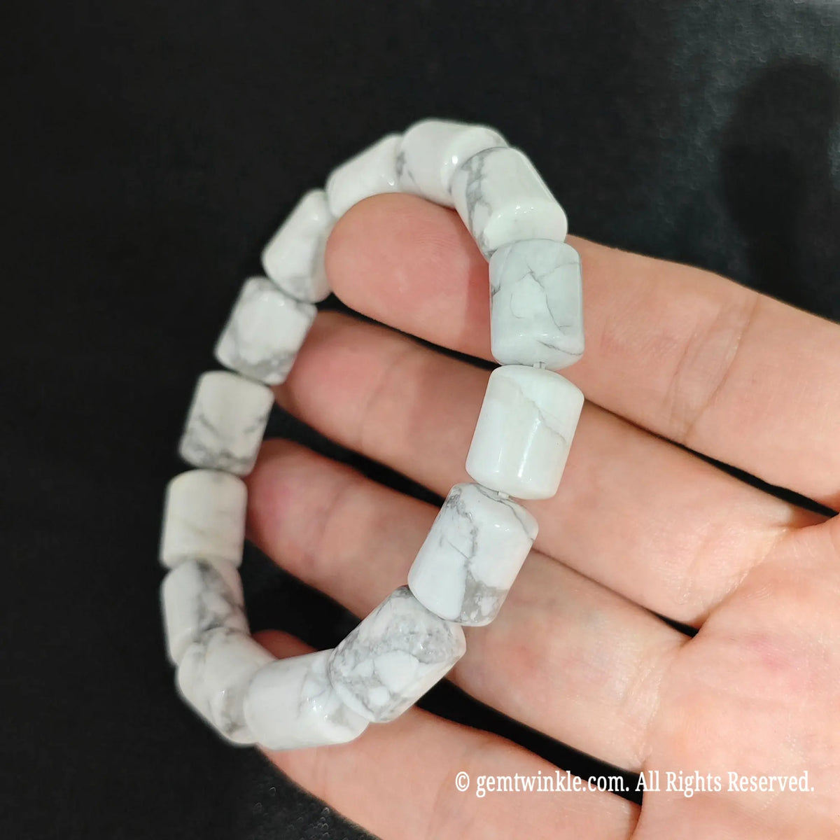 White Howlite Cylindrical Barrel Beads Close Up on Hand