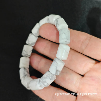 White Howlite Cylindrical Barrel Beads Close Up on Hand
