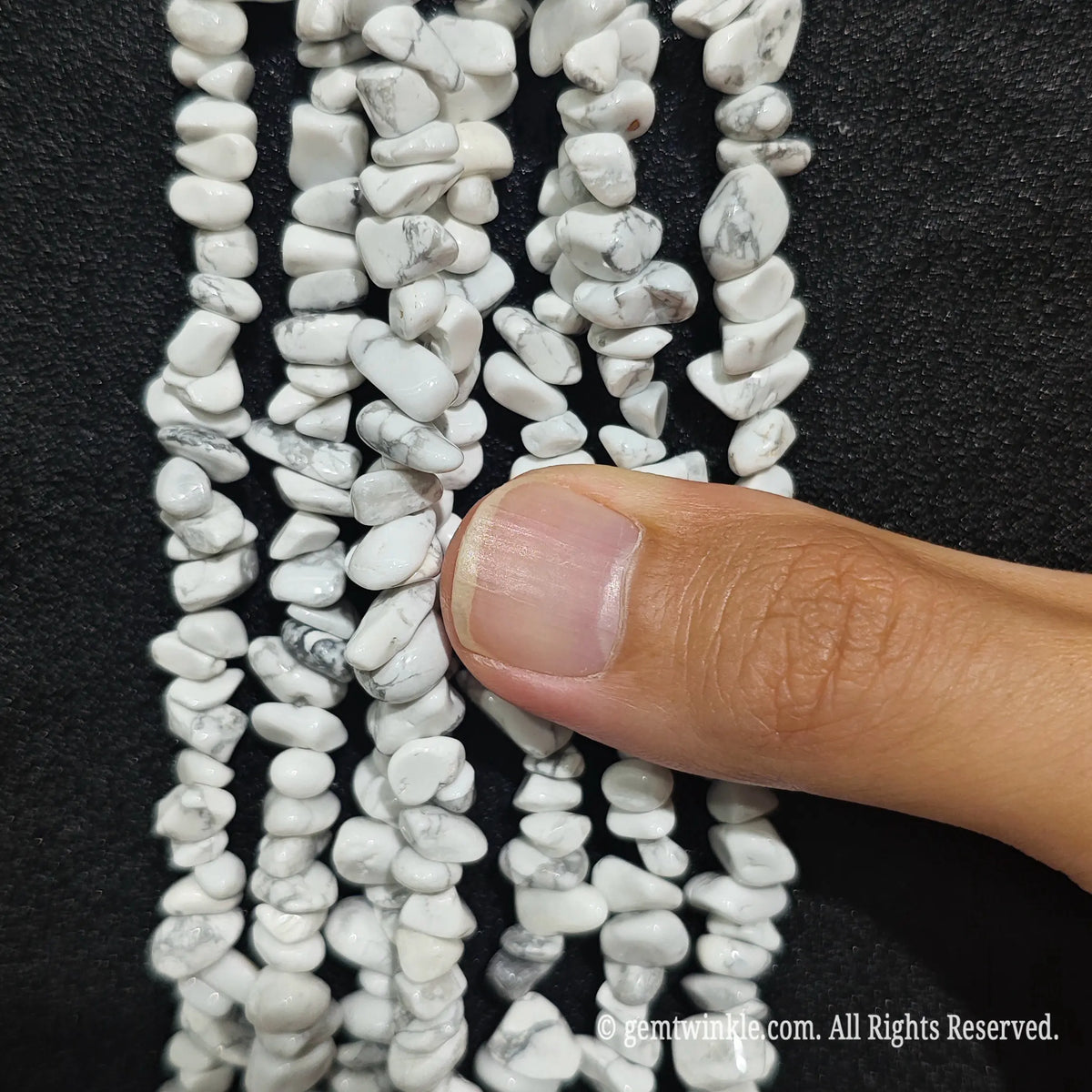 Detailed view of long 75cm natural white turquoise chipped strand ready for DIY jewelry projects