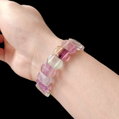 Multicolor fluorite oval bead bracelet worn on wrist, demonstrating elegant fit and soft color transition for daily wear