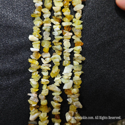 Detailed view of long 75cm natural yellow opal chipped strand ready for wholesale DIY projects