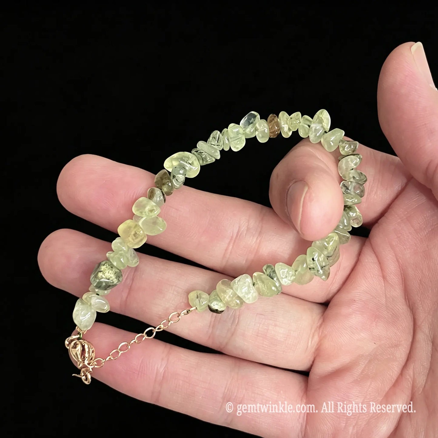 adjustable prehnite chip bracelet showing 5cm gold tone extender chain and lobster clasp