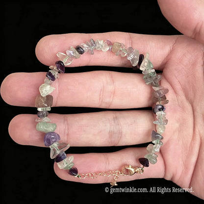 adjustable rainbow fluorite chip bracelet showing gold tone lobster clasp and extension chain detail