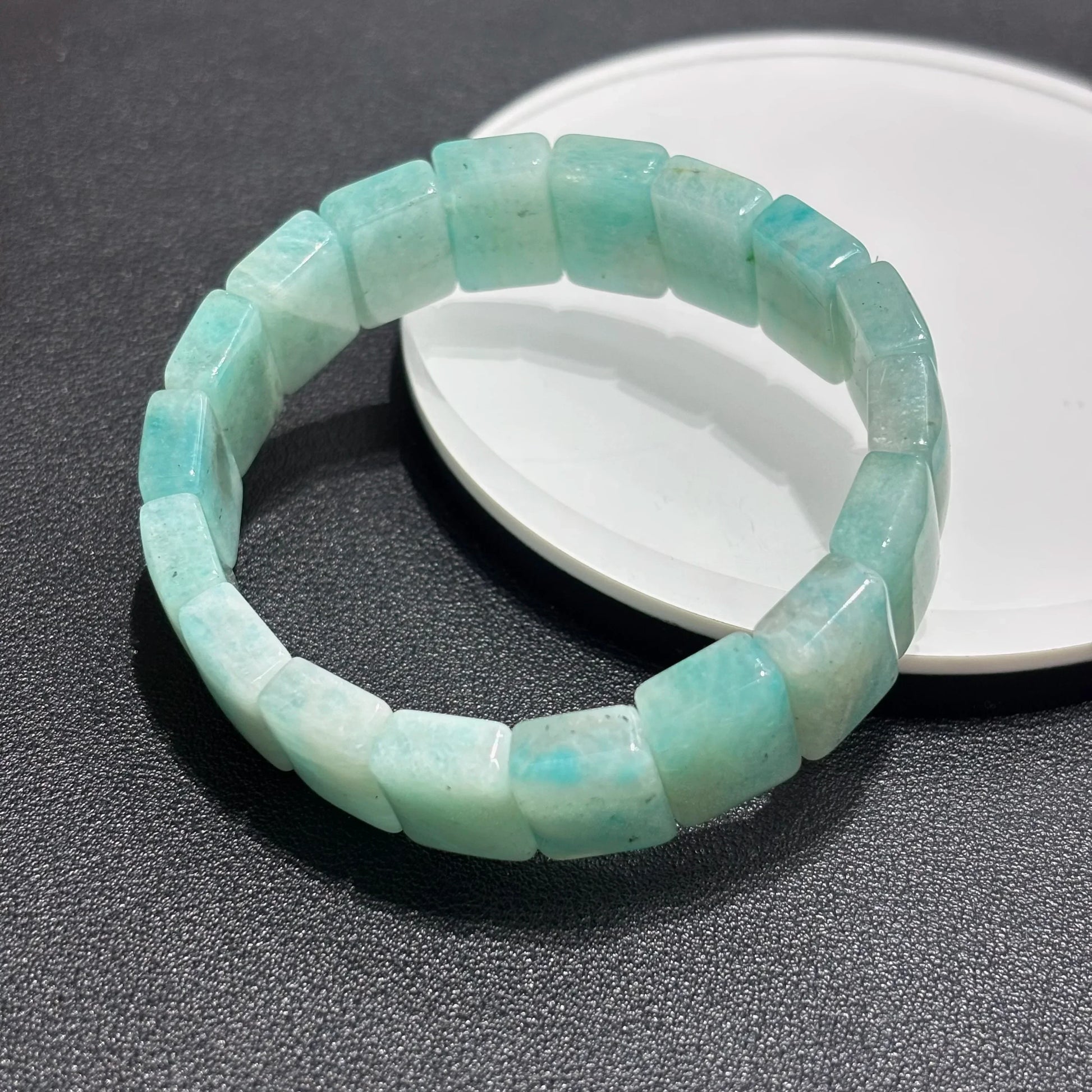 Amazonite Square Bead Bangle displayed on a white plate, highlighting the 18mm x 15mm bead size and smooth texture.