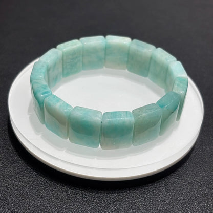 Stackable Amazonite Bangle Bracelets on a white plate, demonstrating how the bracelets look when worn together.