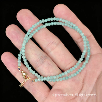 amazonite faceted micro bead double wrap strand held in palm with gold tone clasp