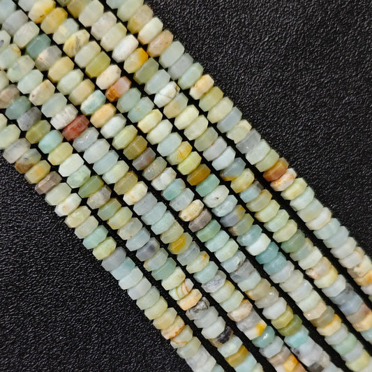 Macro closeup of natural amazonite faceted rondelle beads 6x3mm showing mint green seafoam matrix