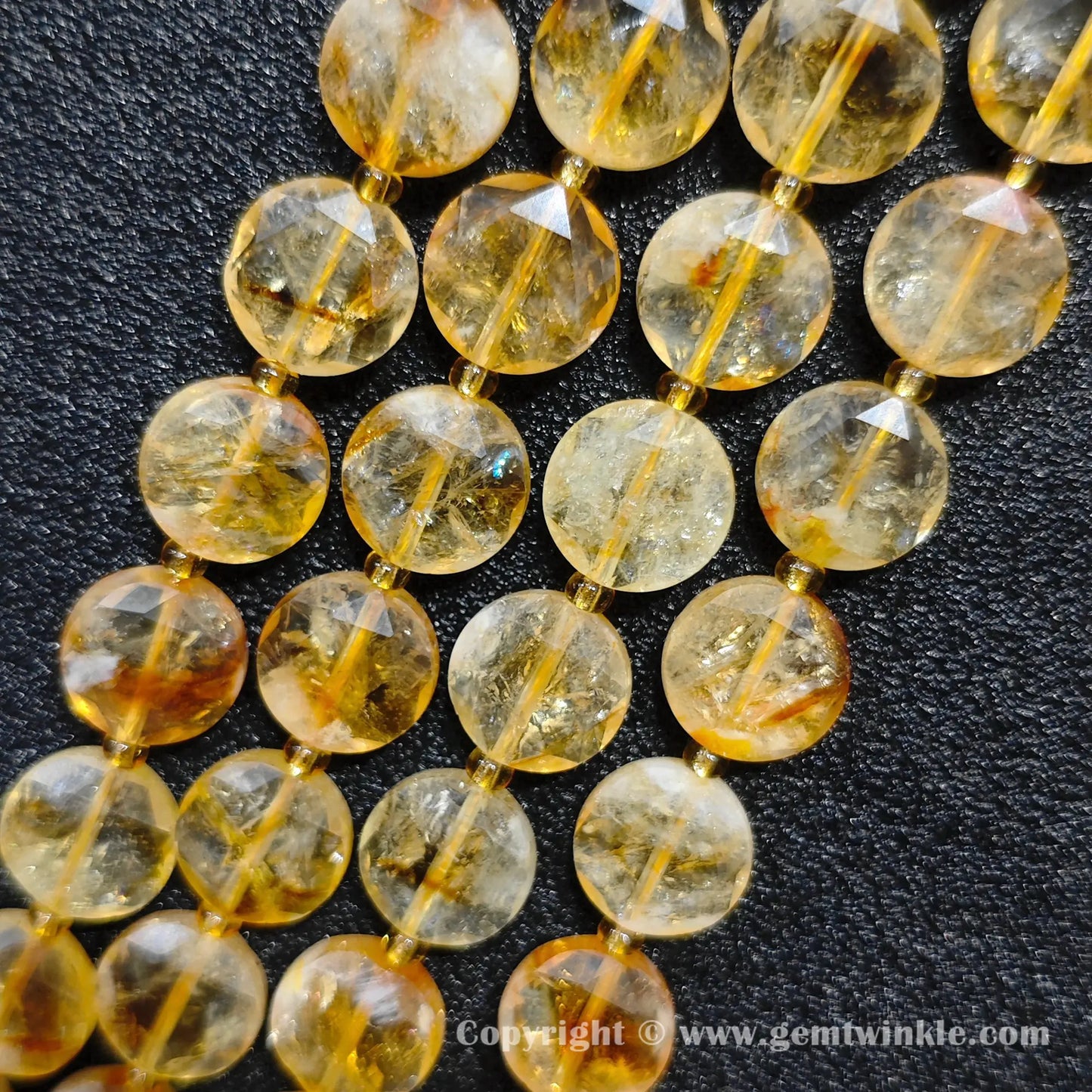 Close up preview of heat treated amber citrine lenticular wheel beads
