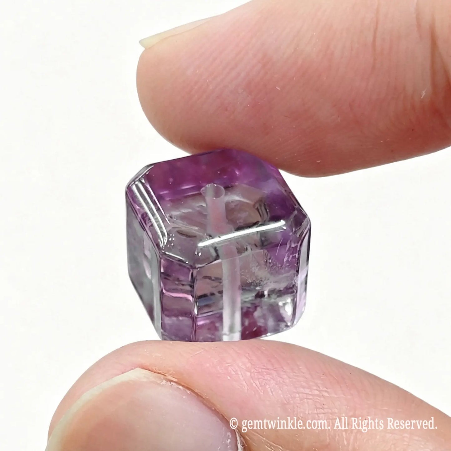 Angled view of amethyst cube bead showing geometric shape and rich violet color clarity
