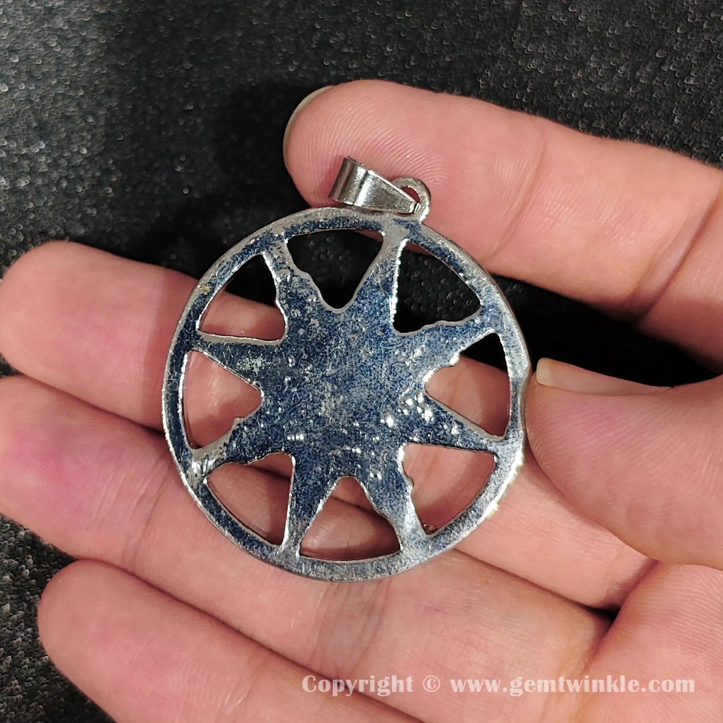 Back view of 45mm metal alloy star frame showing enclosed round amethyst stone with internal cloud patterns