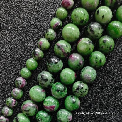 genuine untreated ruby zoisite crystal round beads strands showing natural pink patches and black spots