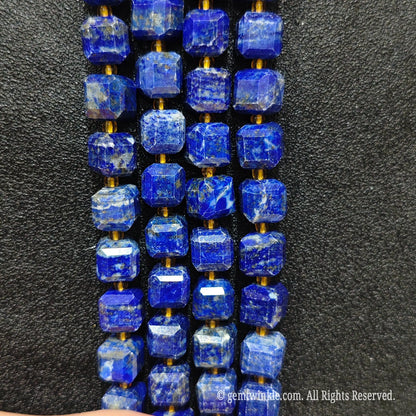 Designer hand holding lapis lazuli gemstone strands to demonstrate bead scale and luster