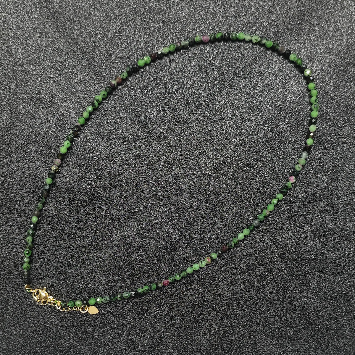 Artistic Ruby in Zoisite gemstone collar necklace featuring 3mm micro faceted beads and gold extension chain