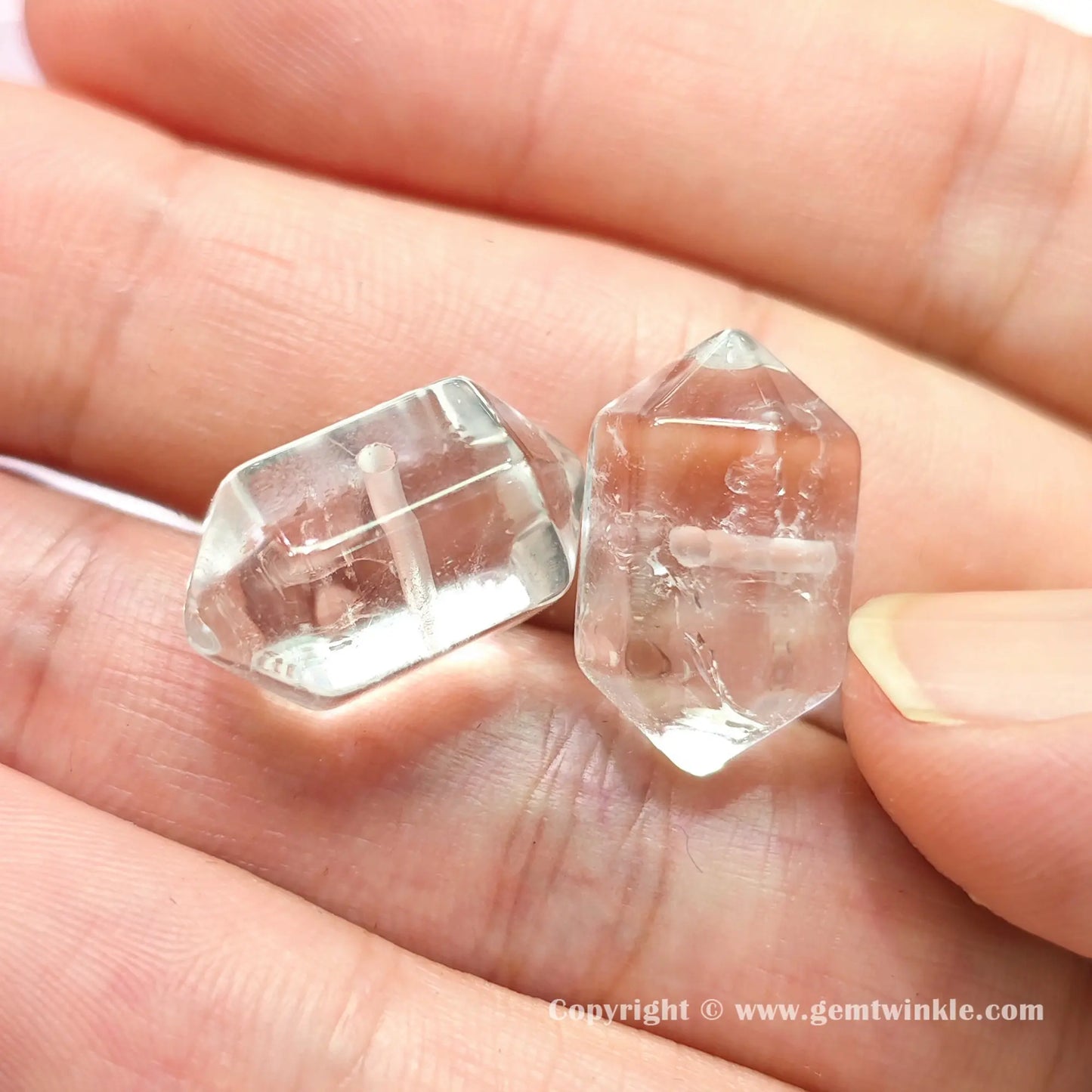 Front view of authentic translucent quartz double point charm bead displaying 18mm size proportions on hand