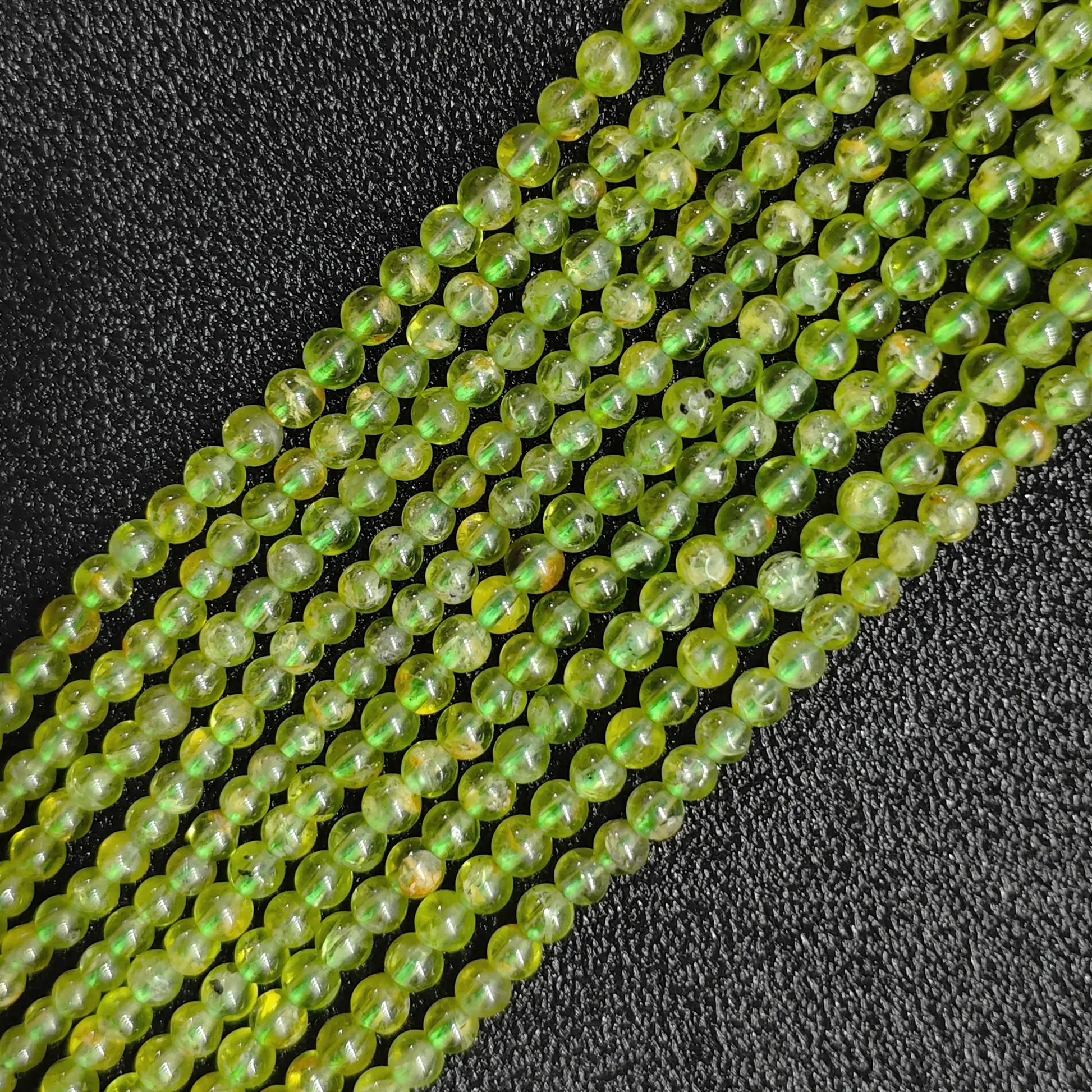 B-Grade natural peridot crystal beads strands showing bright translucent olive green colors in tiny round micro sizes