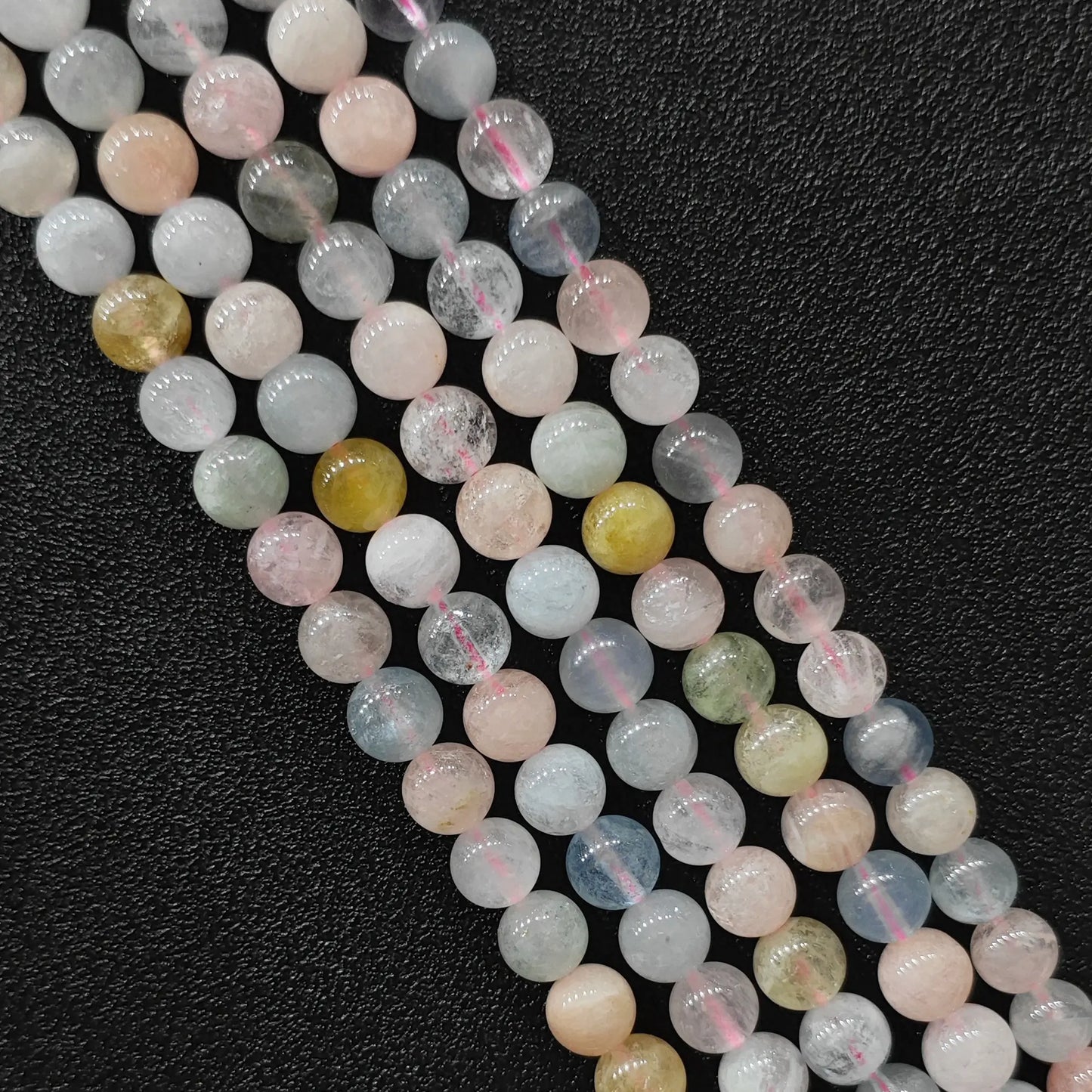 Close up view of b plus grade translucent multi color morganite crystal beads strands showing pastel pink and blue beryl minerals in image_cacfa4.jpg