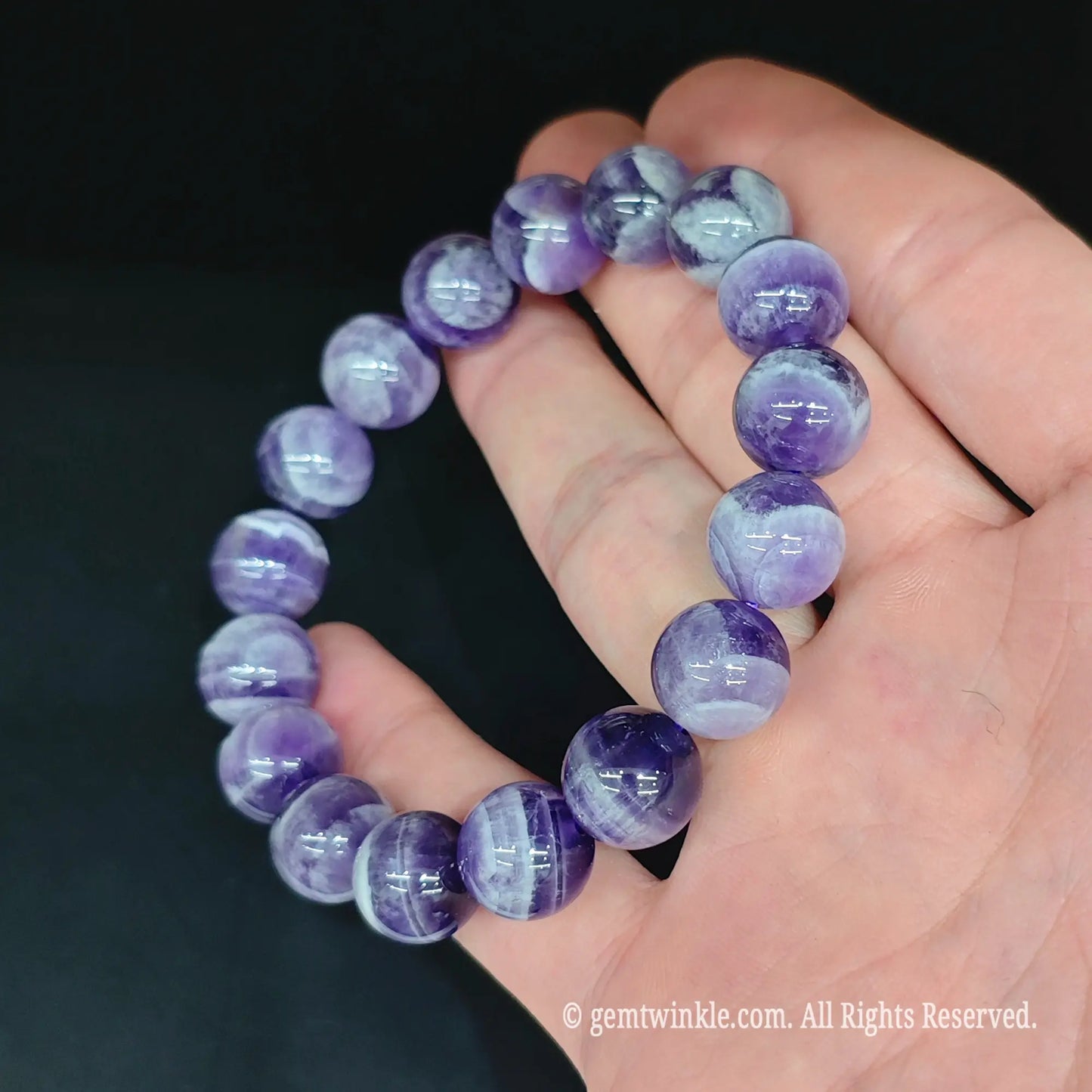 Banded purple dream amethyst bead stretch bracelet top view showing uniform round bead arrangement and smooth finish