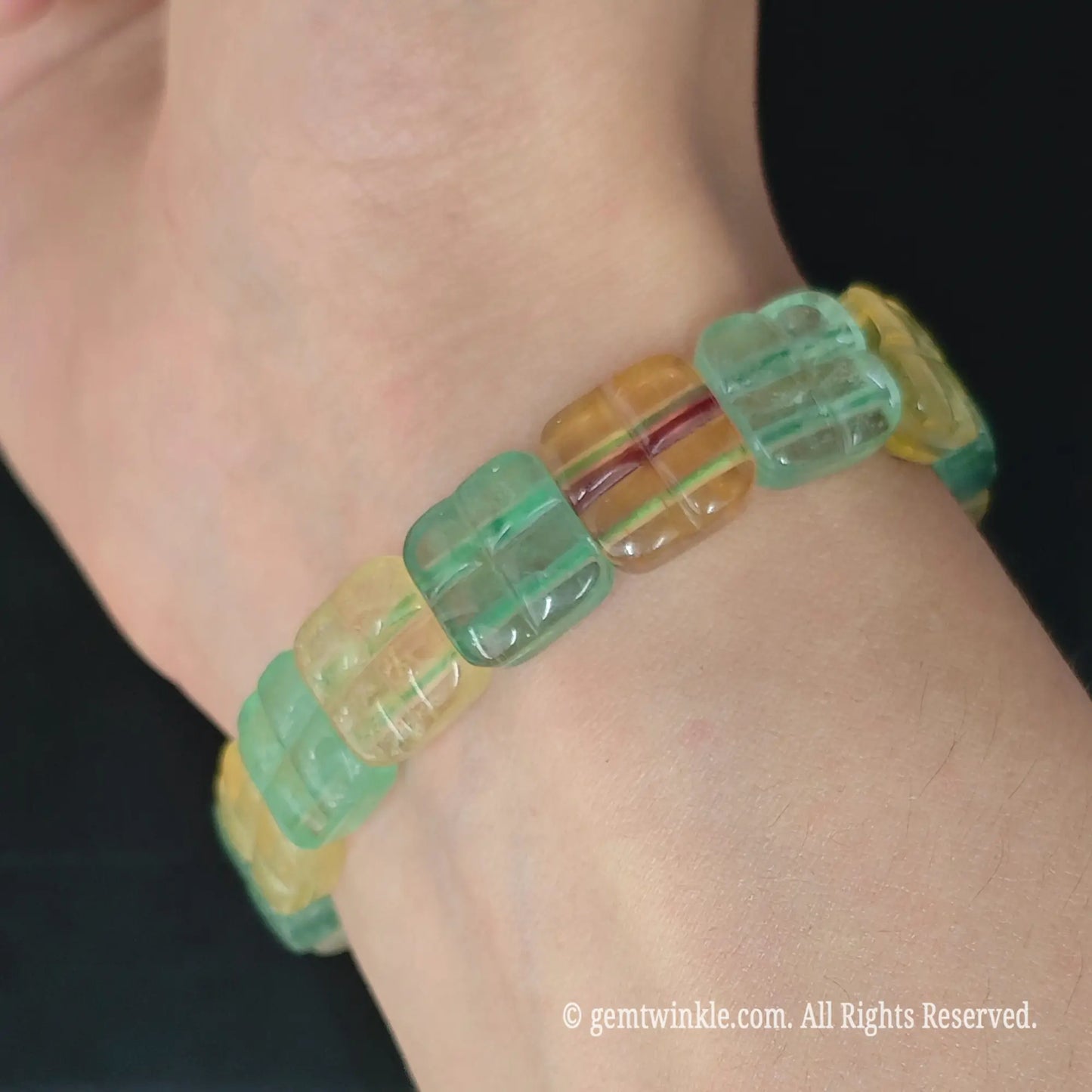 12mm green and yellow fluorite windowpane square bead stretch bracelet worn on wrist