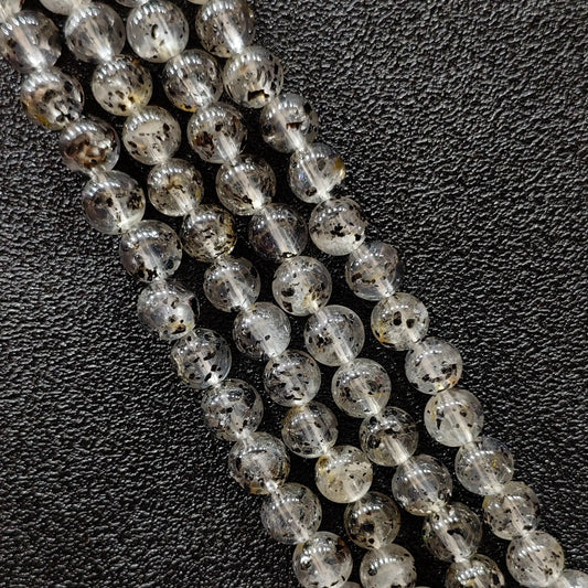 Biotite quartz crystal beads strands showing rich black mica mineral inclusions in clear gemstone round shapes