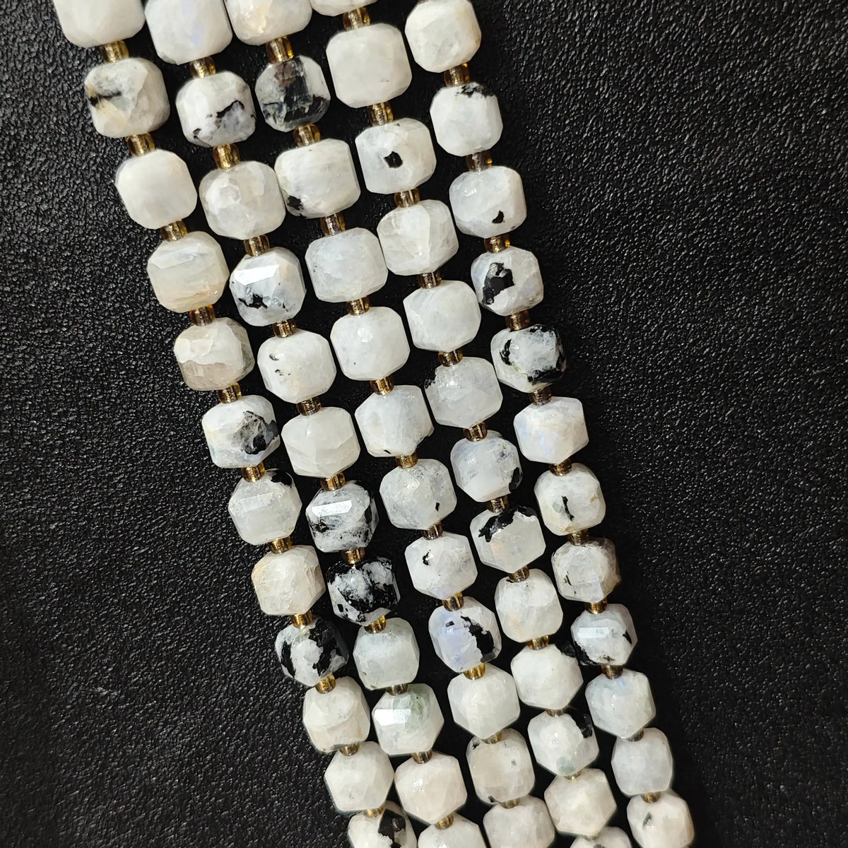 Full strands of natural black spot blue moonstone square block beads featuring artistic mineral inclusions for wholesale buyers