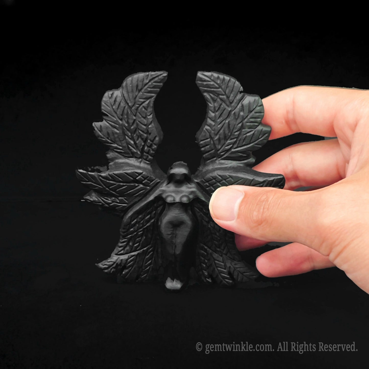 Close up of the polished 10cm black obsidian Seraphim angel statue perfect for premium gothic boutique store inventory