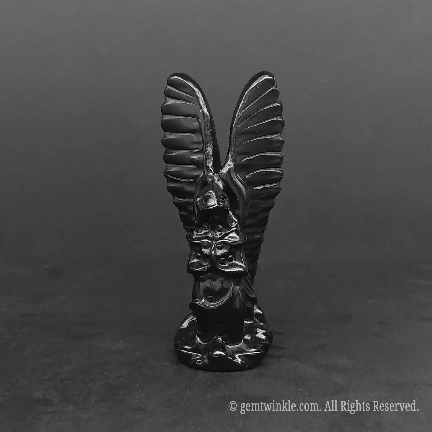 Glossy black obsidian protection angel wings figurine for modern gothic or metaphysical home styling