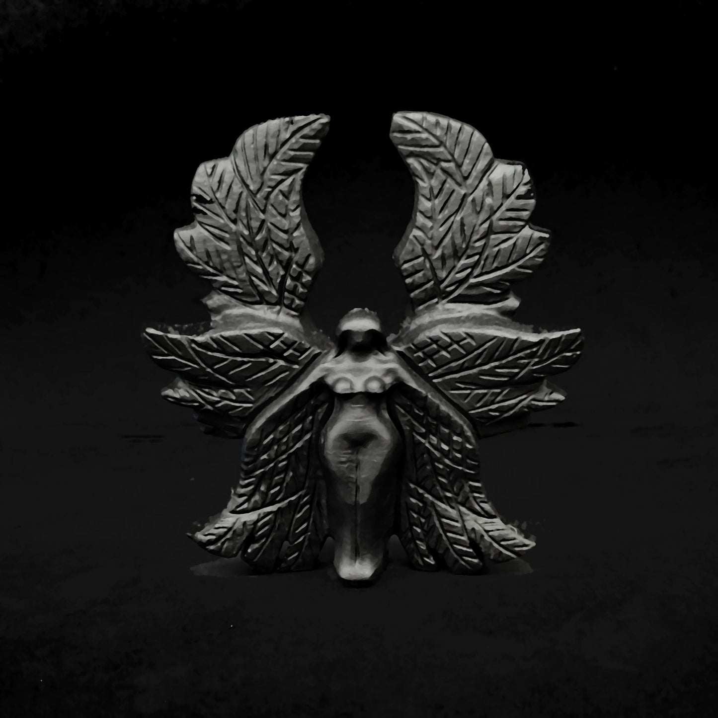 Front view of a 10cm hand carved black obsidian Seraphim statue showcasing symmetrical six layered wings