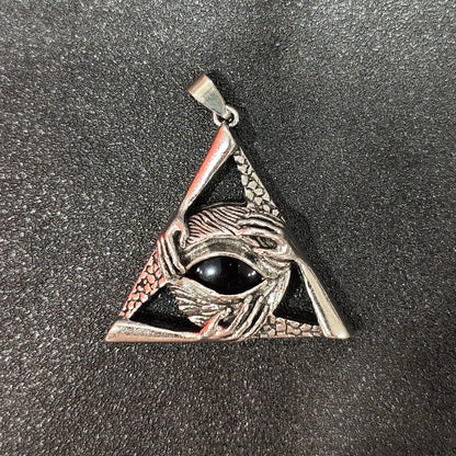 Black obsidian round cabochon set in antique silver triangle metal frame with eye motif