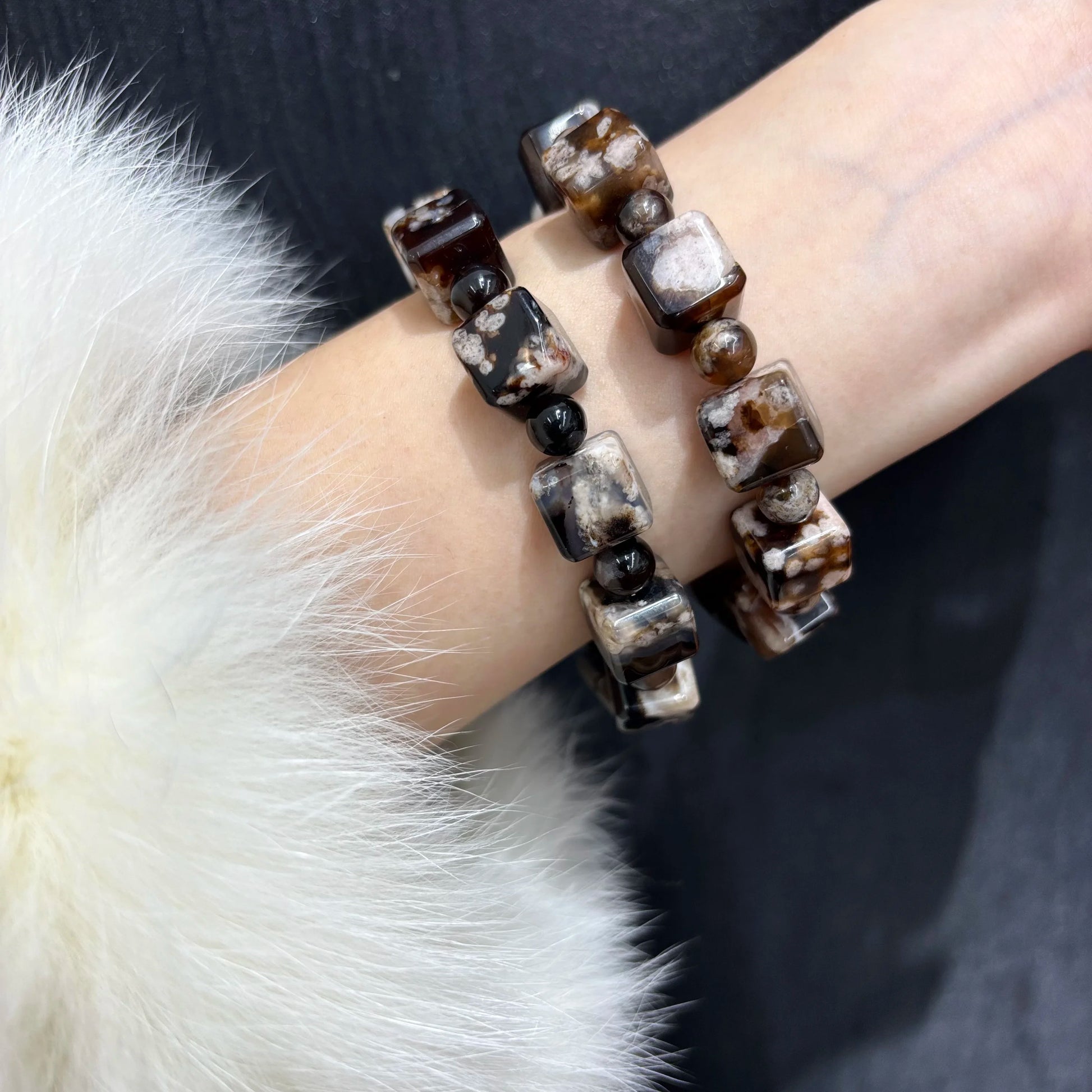 Black Sakura Agate bracelet worn on wrist, showing fit and style, boho fashion accessory.
