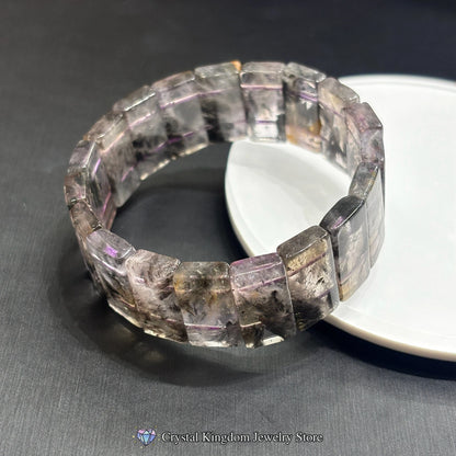 black dream phantom quartz rectangular slab bracelets crossed on white disc