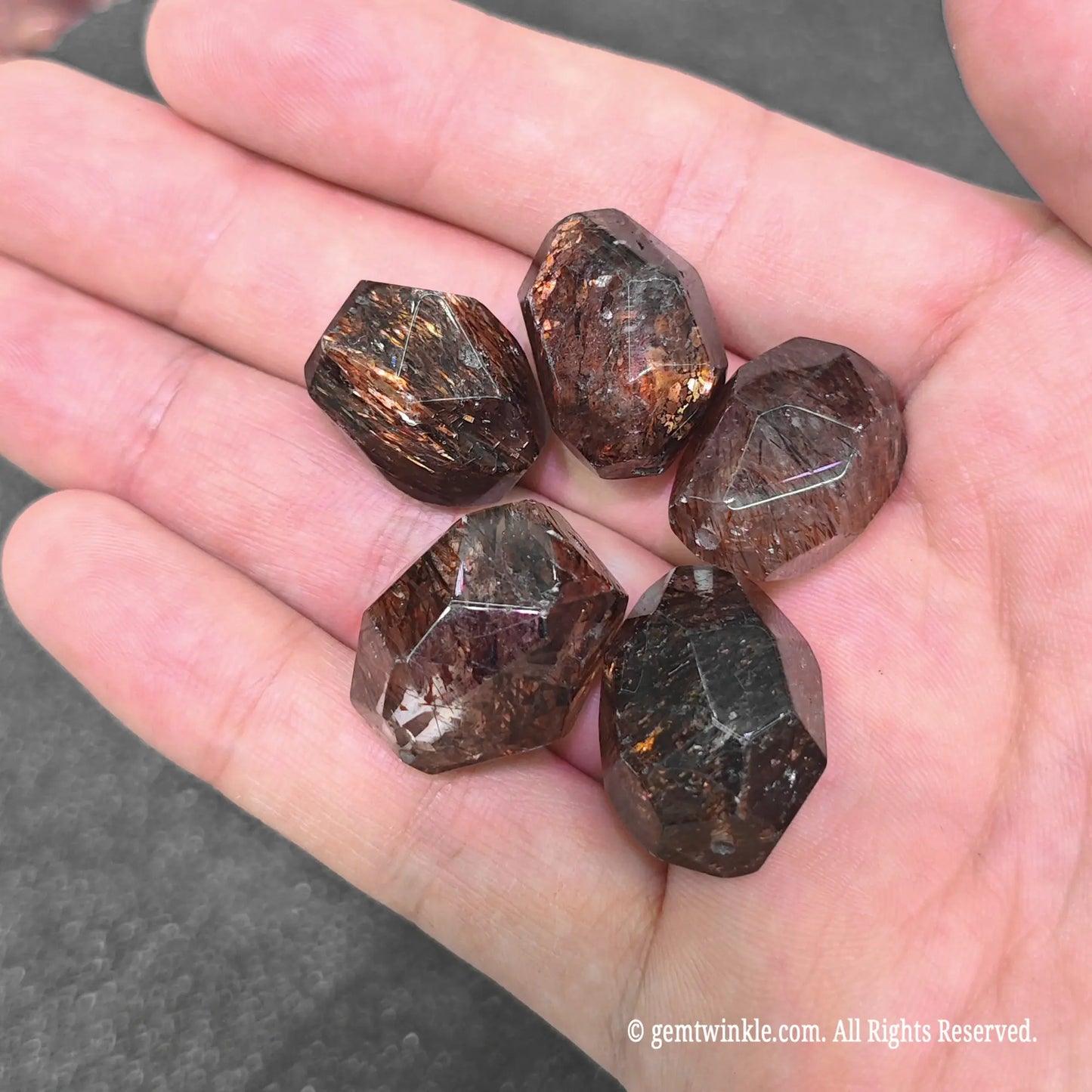 black lepidocrocite quartz geometric beads displaying dense golden copper mineral shimmer
