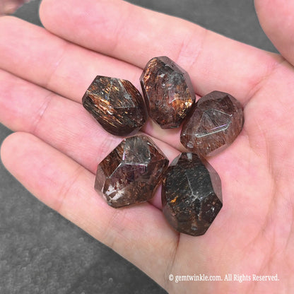 black lepidocrocite quartz geometric beads displaying dense golden copper mineral shimmer