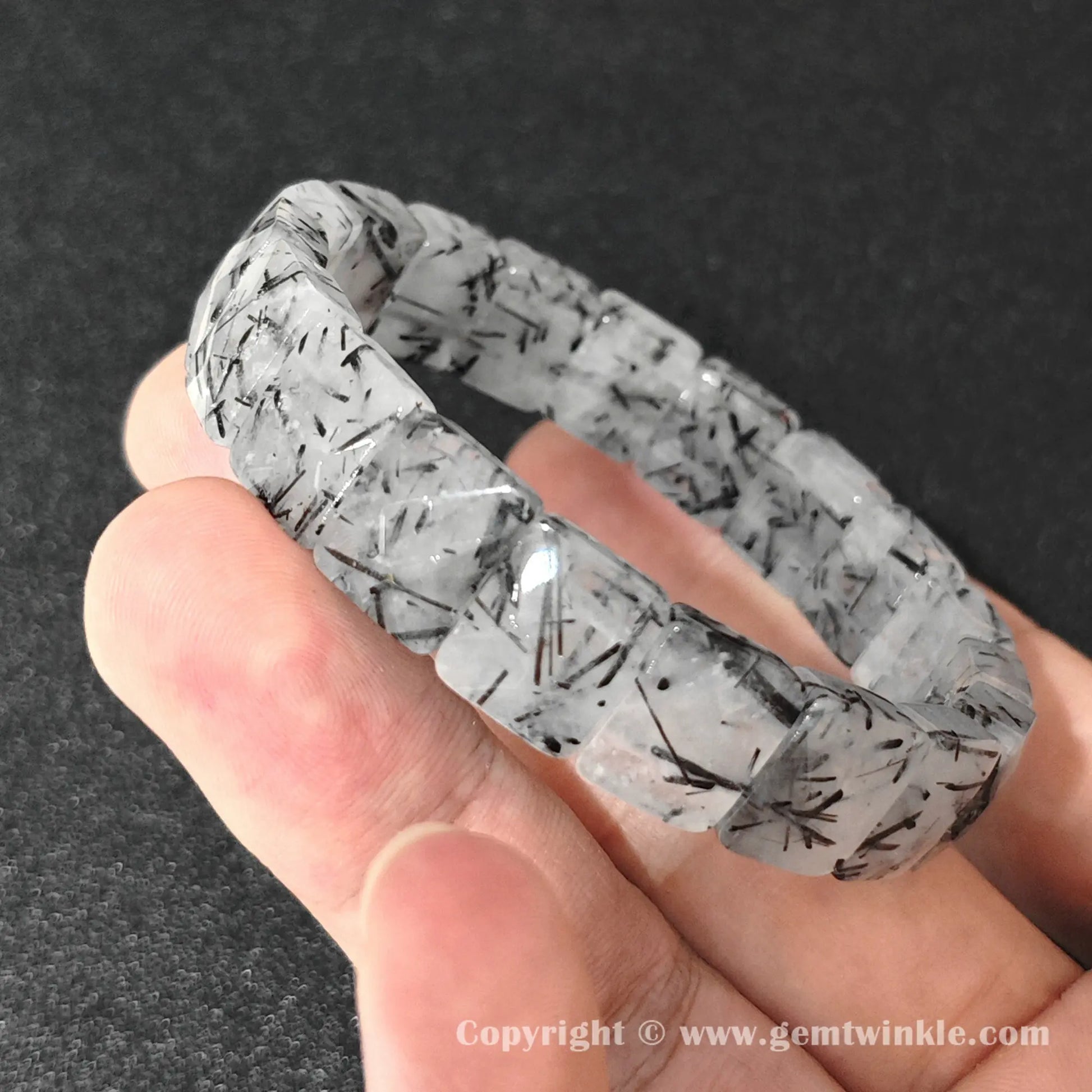 side profile of machine polished black tourmaline quartz plate bracelet showing beveled edges