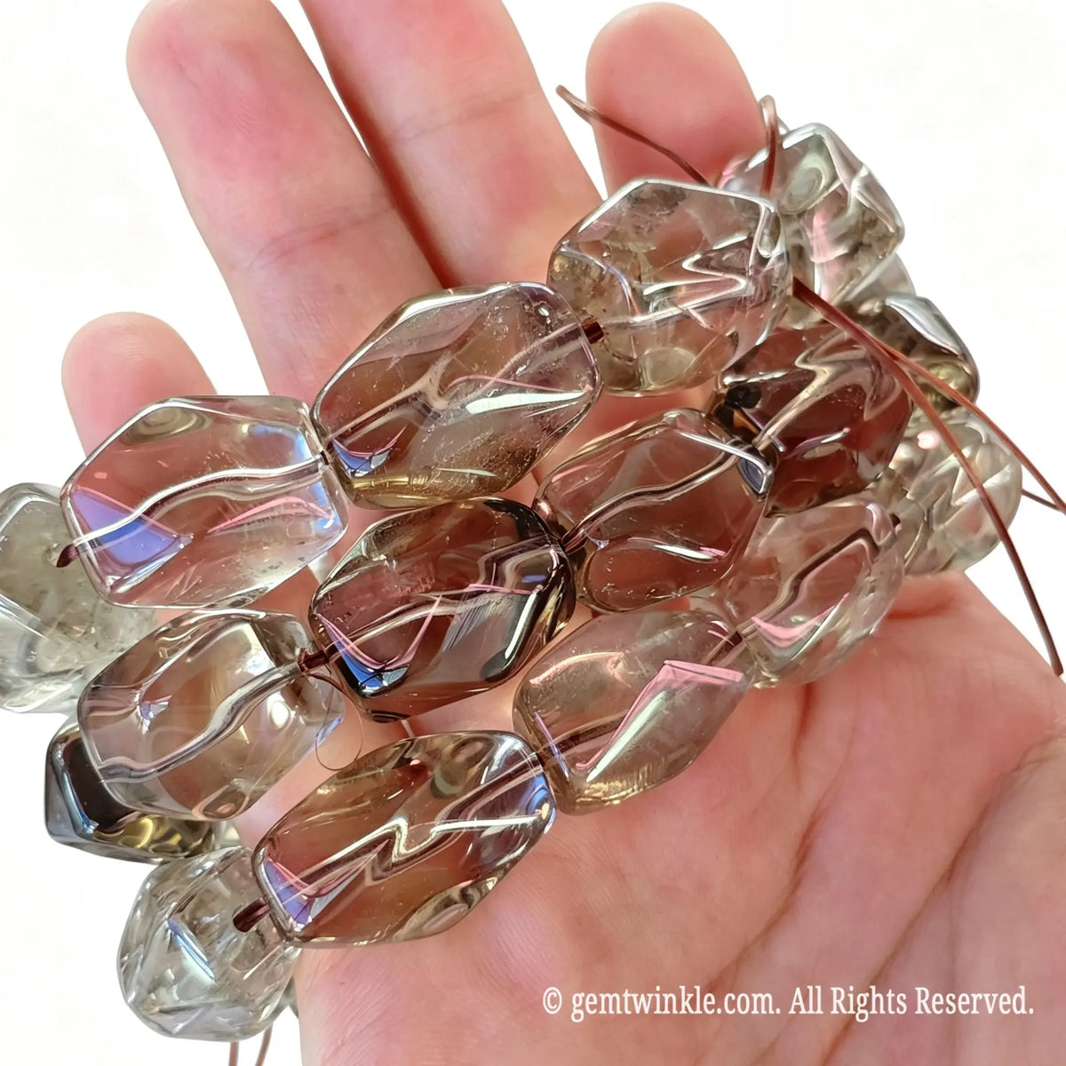 Hand preview of a single-strand chunky smoky quartz freeform bead bracelet with smooth polish