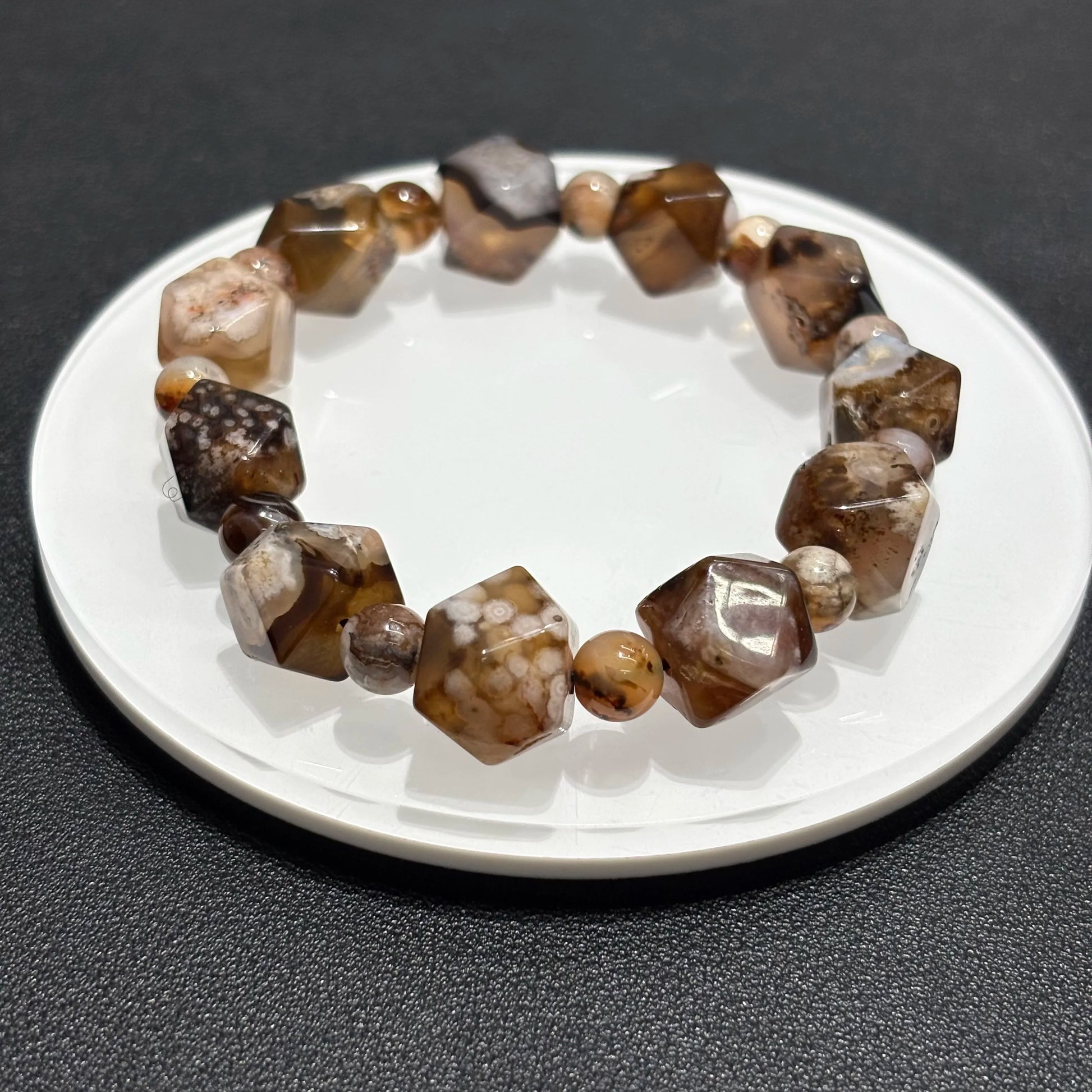 Brown Sakura Agate Bracelet on White Plate