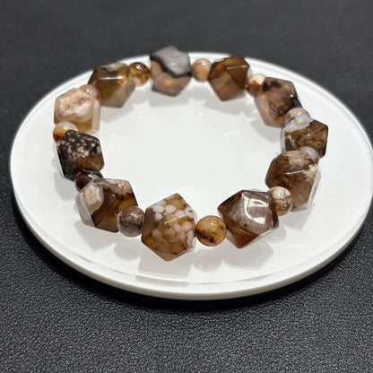 Brown Sakura Agate Bracelet on White Plate