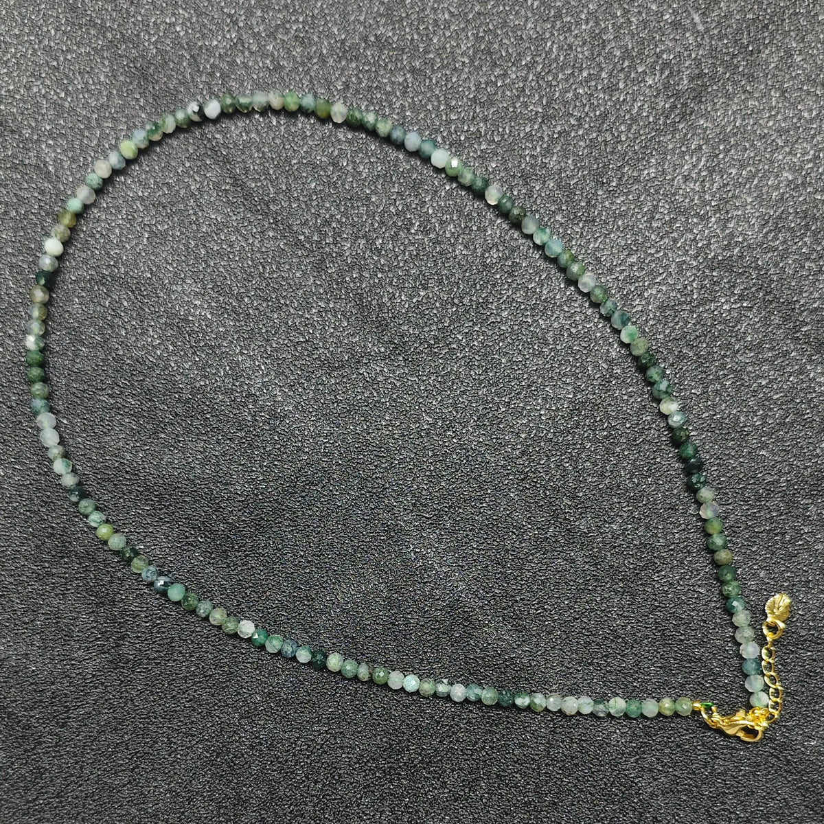 Translucent moss agate faceted necklace with 3mm beads and gold extension chain layout for wholesale supply