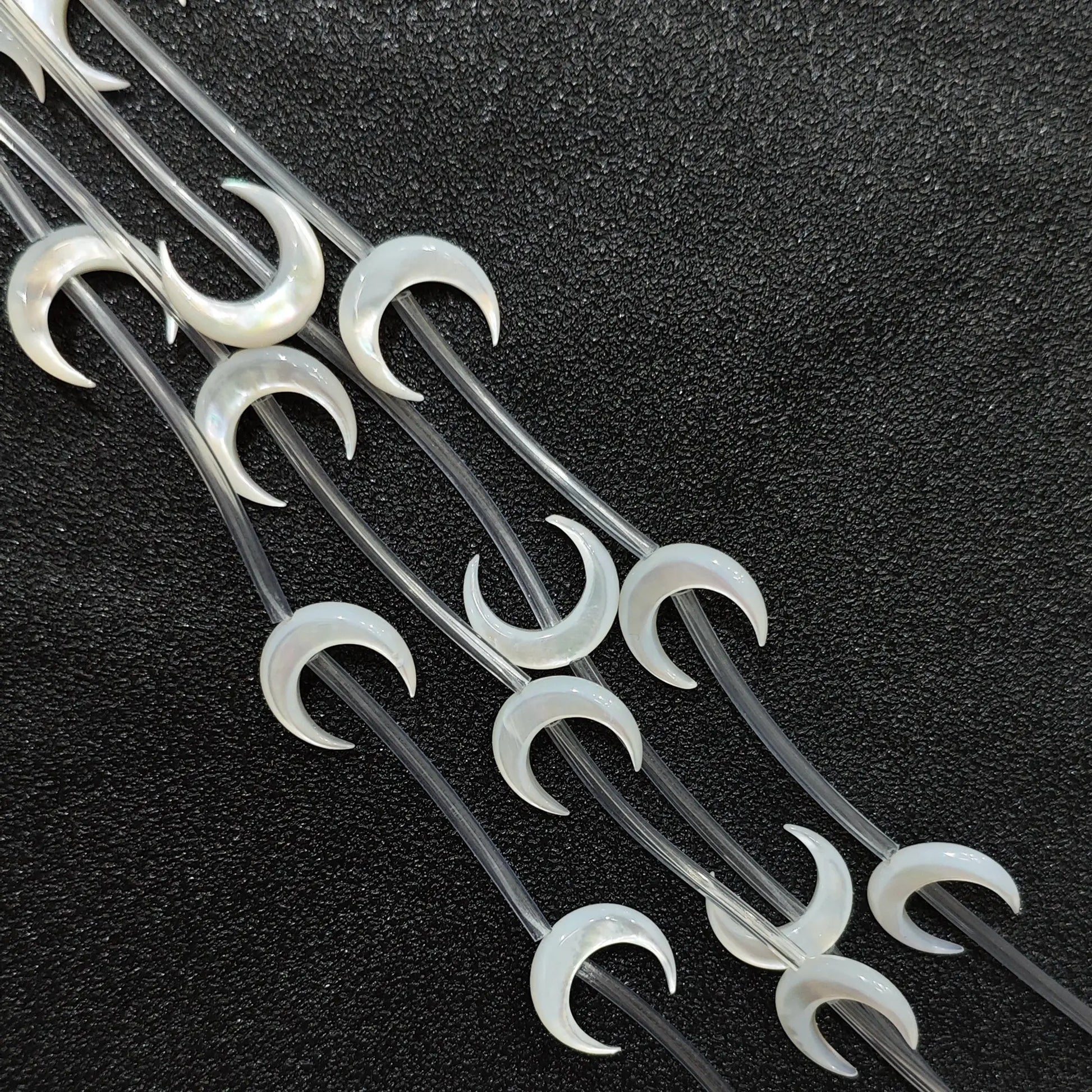 Carved crescent moon white mother of pearl beads full strand view