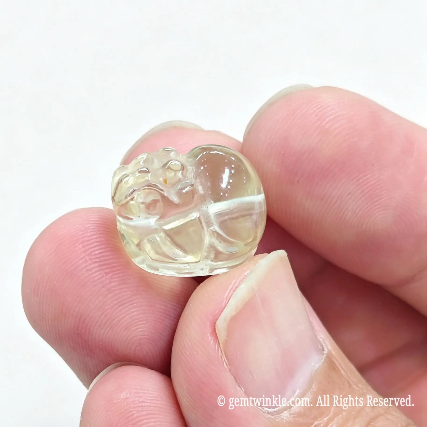 Single lemon quartz Pixiu bead showing drilled center hole for DIY bracelet making