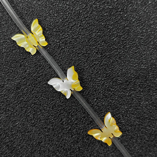 carved butterfly yellow mother of pearl beads strand view