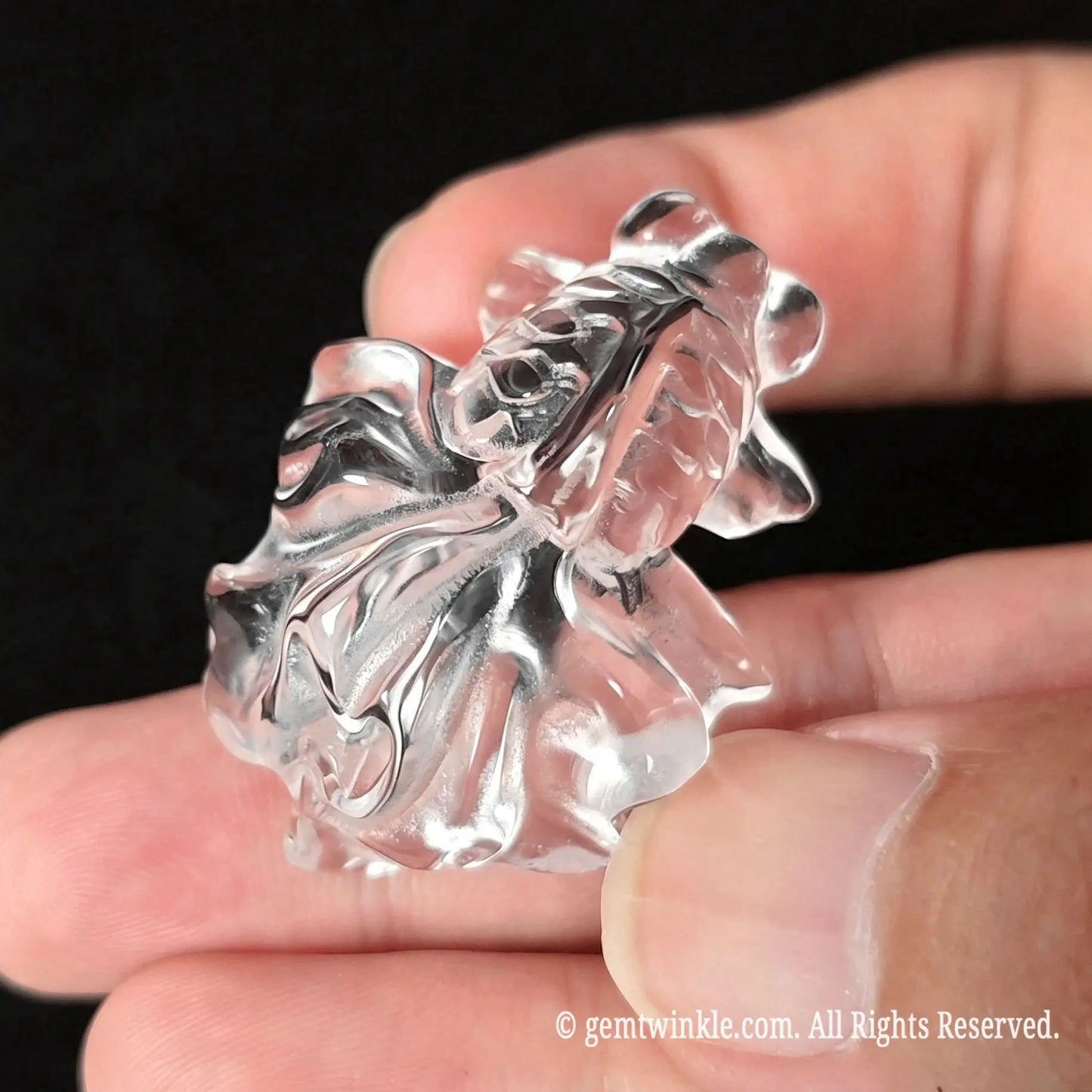 Top view of 30mm clear quartz carved goldfish showing smooth polished body and wide transparent tail