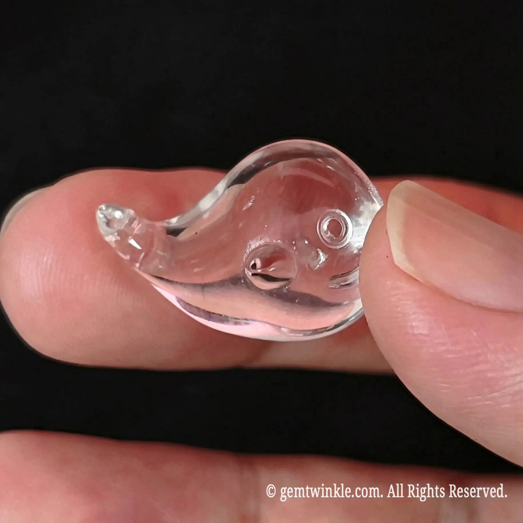 carved crystal whale figurine top view