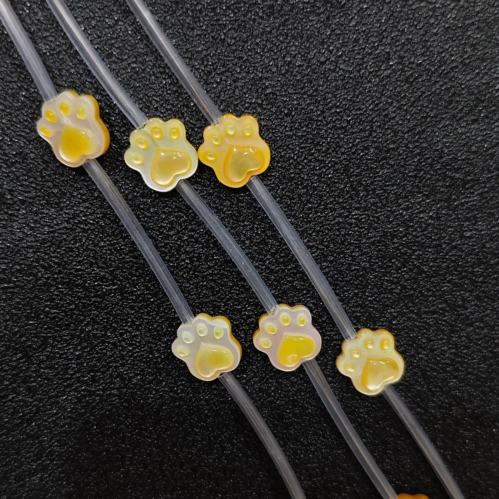 Cat paw yellow mother of pearl beads full strand view