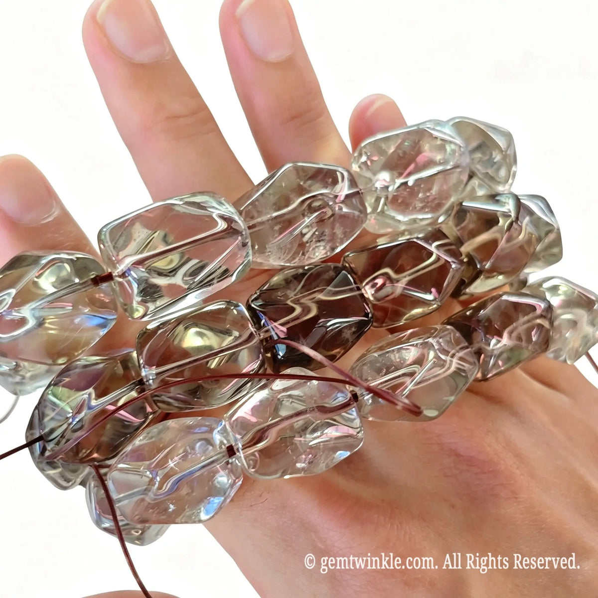 Close up preview of ~20mm freeform smoky quartz beads highlighting clarity and natural crystal facets
