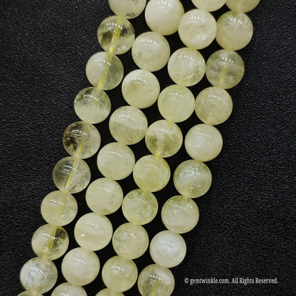 Affordable B grade lemon citrine crystal strands with prominent natural phantom ice cracks permanent color