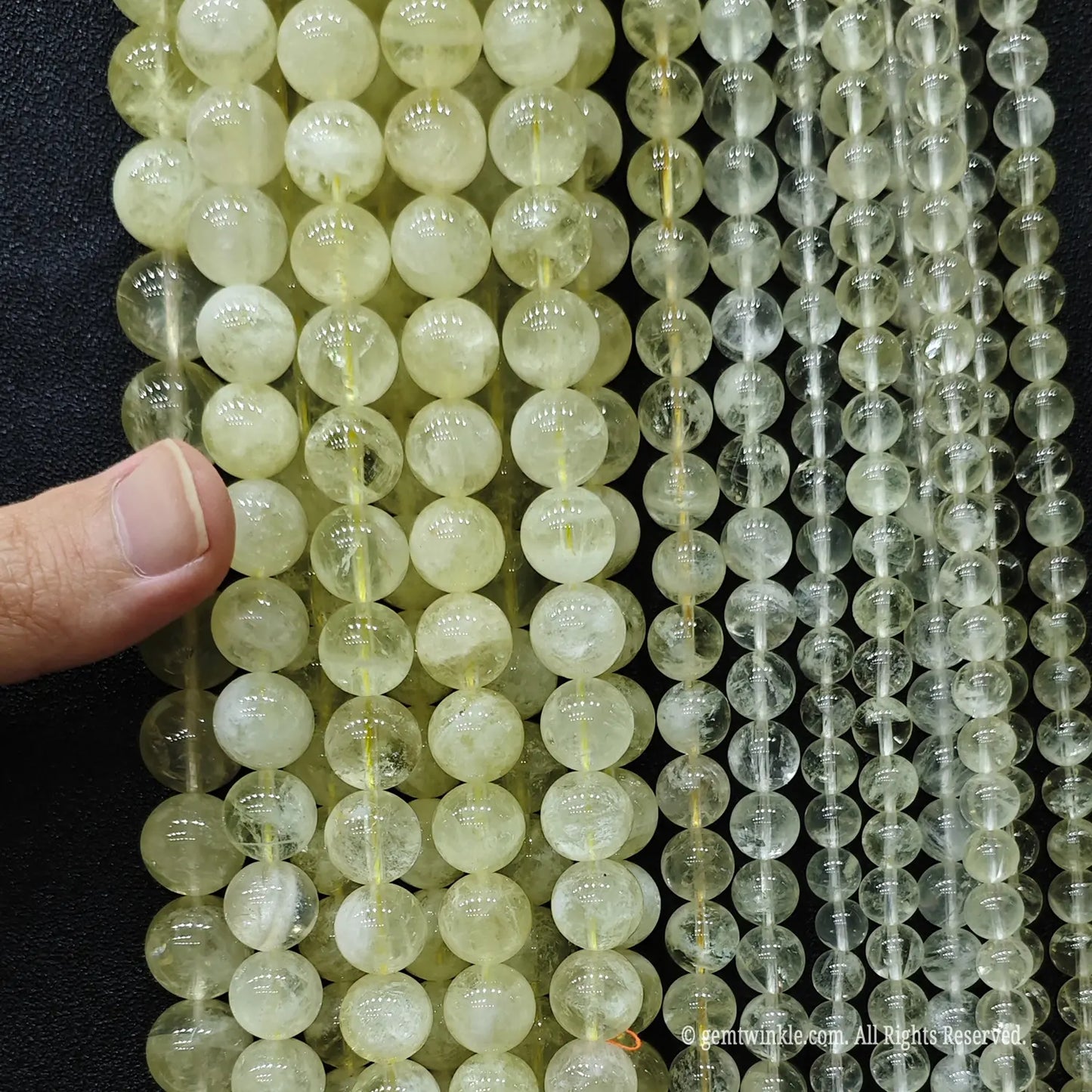 Economy B grade lemon citrine quartz strands size comparison from 8mm to 14mm showing heavy inner wisps