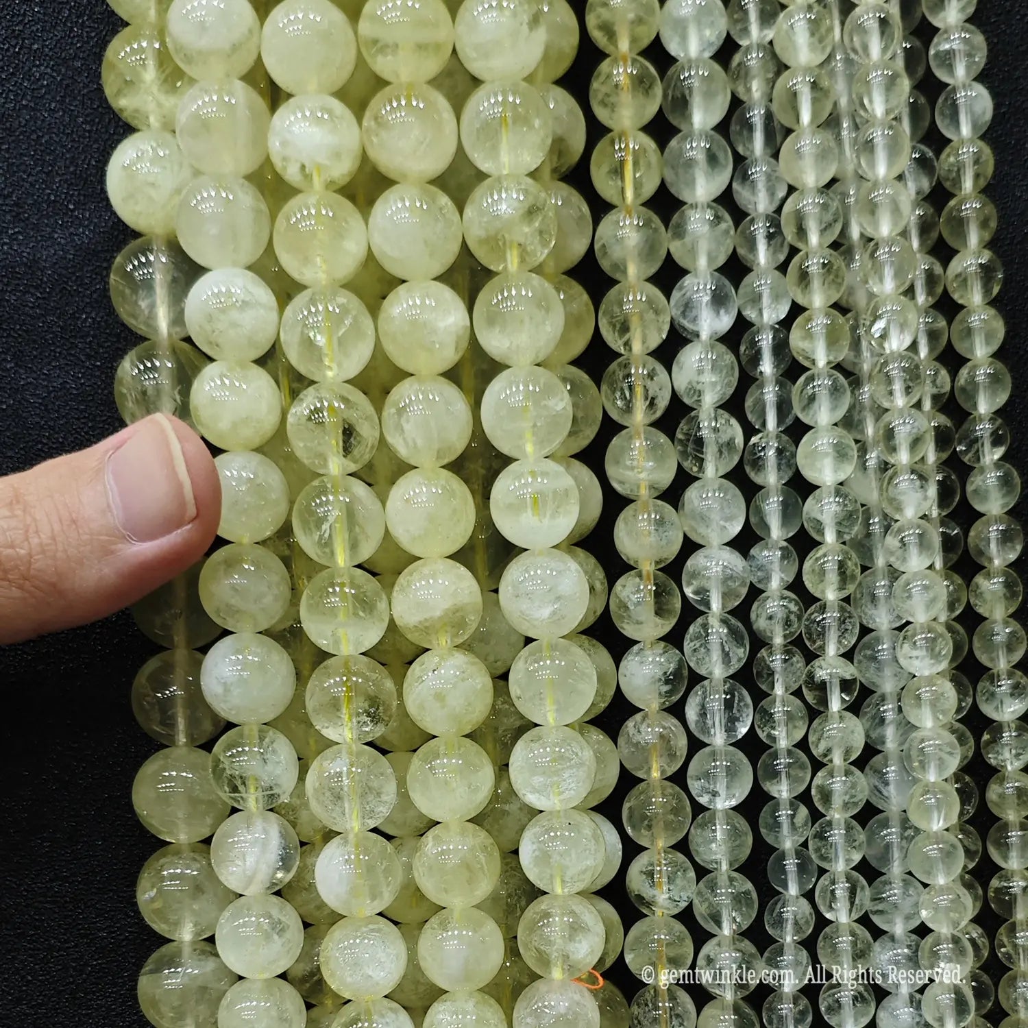 Economy B grade lemon citrine quartz strands size comparison from 8mm to 14mm showing heavy inner wisps